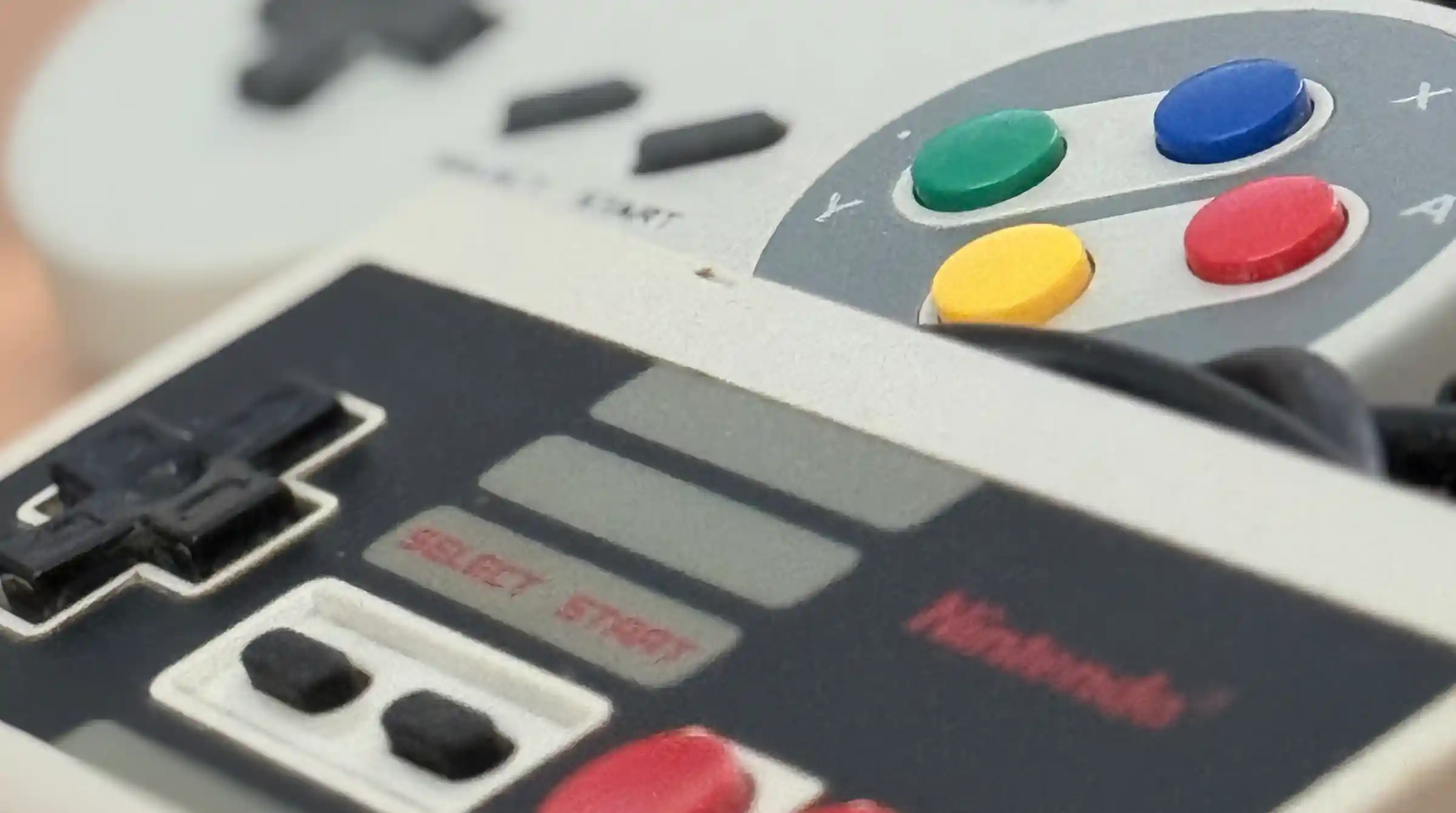 Close-up of vintage NES and Super Nintendo controllers
